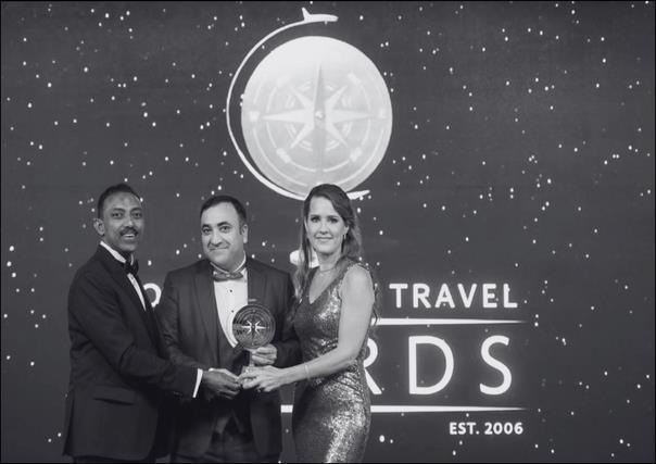 AB team receiving the World Luxury Travel Award on stage